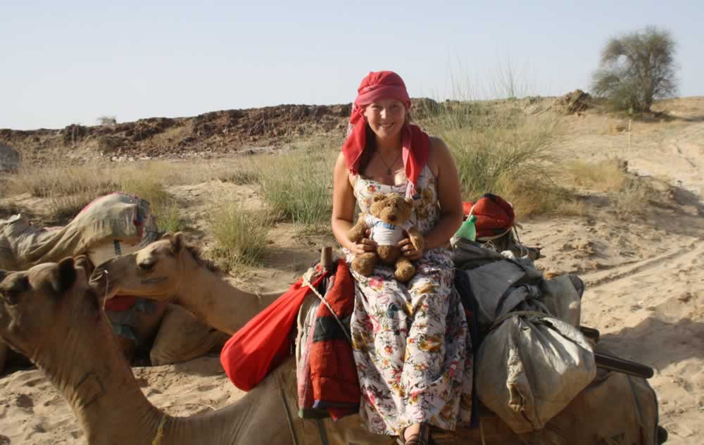 Amy and Ladywell Bear prepare for a bumpy dusty ride through the desert
