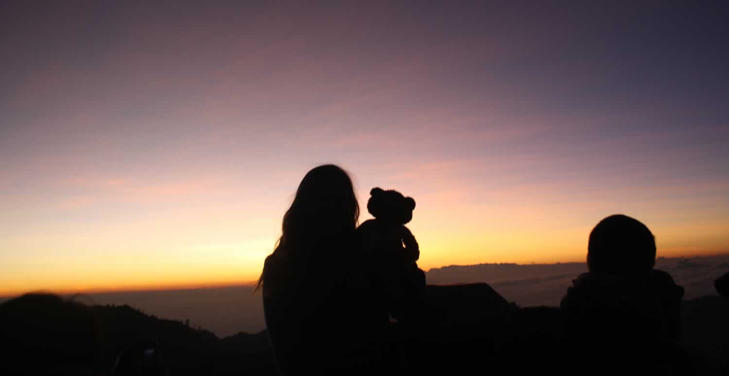 Friends together share a beautiful Indonesian sunset.