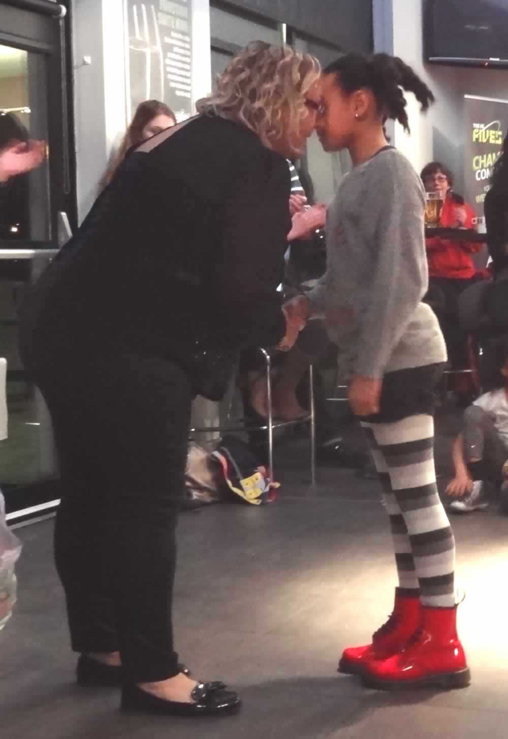 Shirley and Ella exchange a Maori Greeting