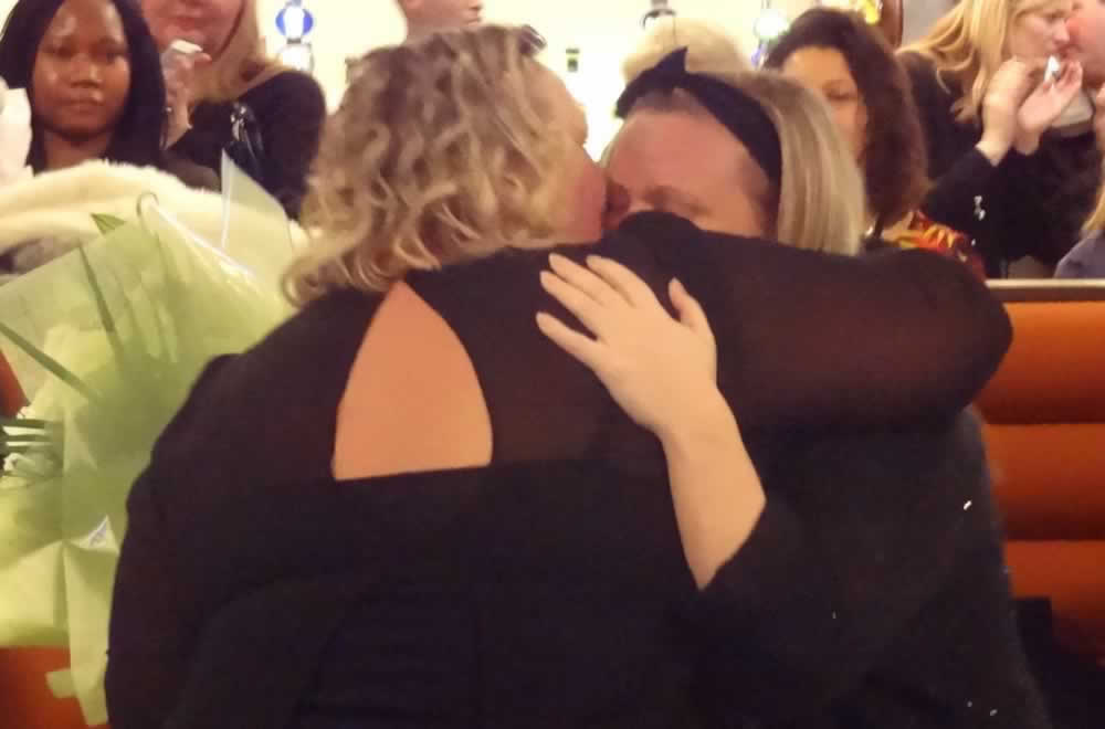 Shirley hugs Nic after presenting her with her Loyal Service Award