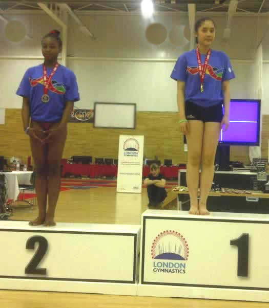 Celeste and Quinh with their Floor medals