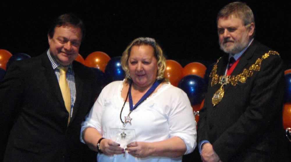 Shirley receiving her second place award in the Service to Sport category.